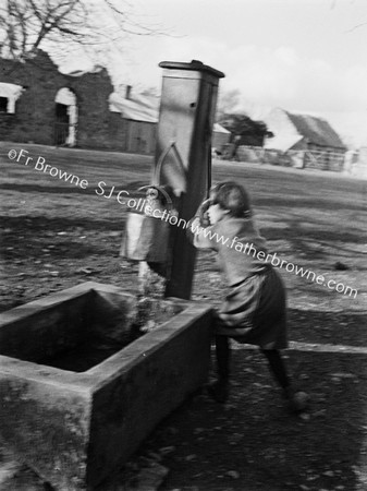 GIRL AT VILLAGE PUMP